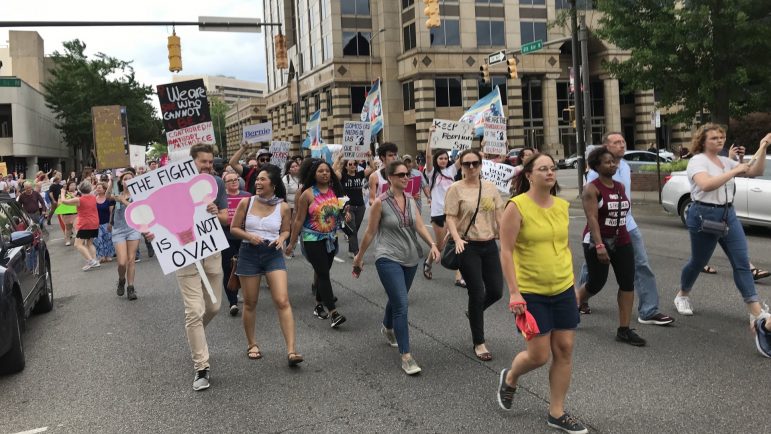 Abortion rights supporters march around downtown Birmingham on Sunday, May 19, 2019.