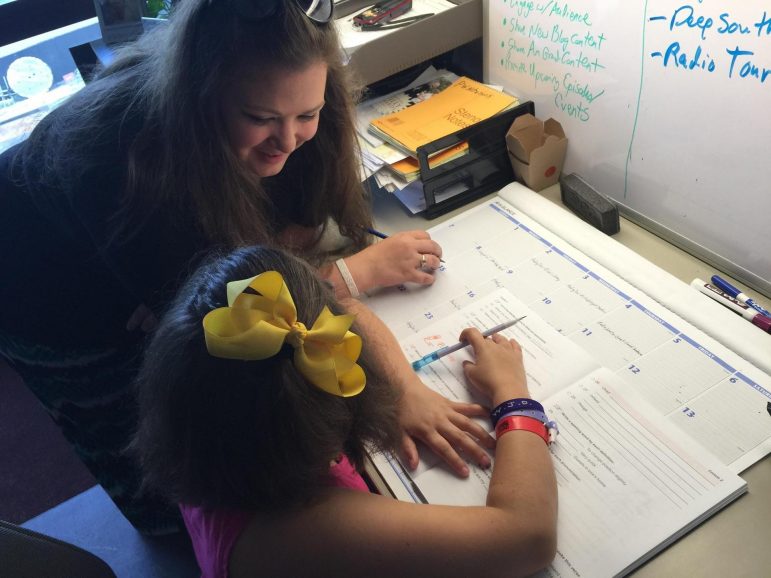 Anna Davis of Picayune and her daughter Isabel doing everyday school work. Credit: Paul Boger/MPB