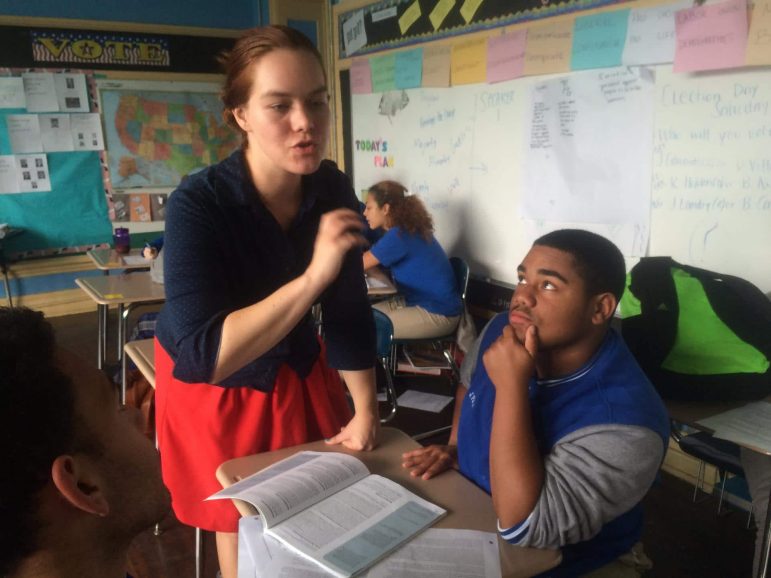 Sarah Cannon helps her New Orleans students prepare for a debate about felon disenfranchisement. Credit: Mallory Falk/WWNO.