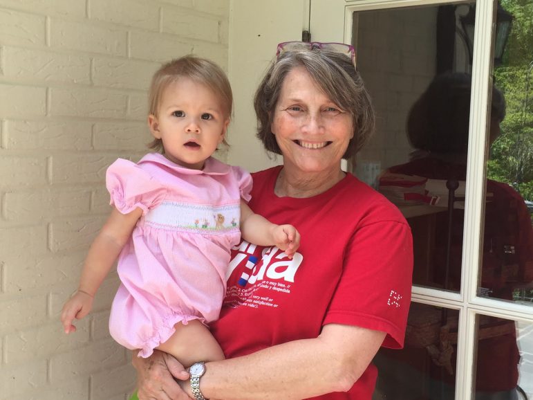 Beth Seibels holds her granddaughter. Seibels suffers from depression, and hopes new technology will make it easier for doctors to predict who is at risk of becoming depressed.