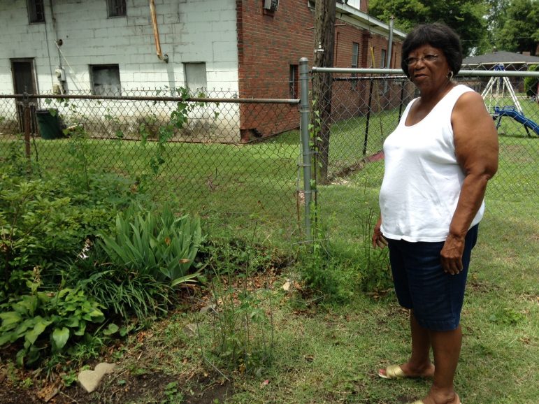 Vivian Starks in front of her backyard garden at her home in Birmingham's Collegeville neighborhood.