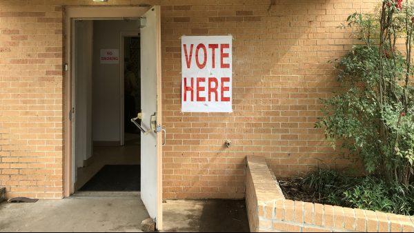 A "Vote Here" sign by the entrance to a polling place in Birmingham
