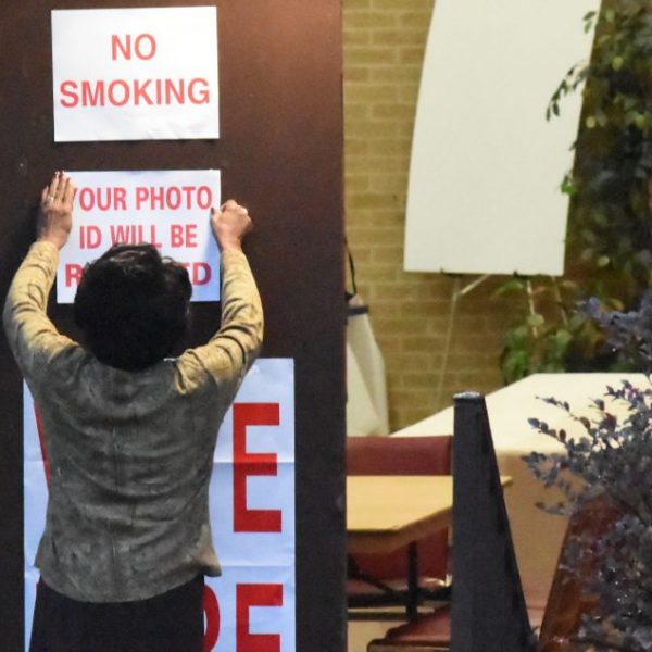 https://wbhm.org/wp-content/uploads/2020/10/Poll-worker-puts-up-signs-at-Sixth-Avenue-Baptist-Church-polling-place-1024x635-1-600x600.jpg