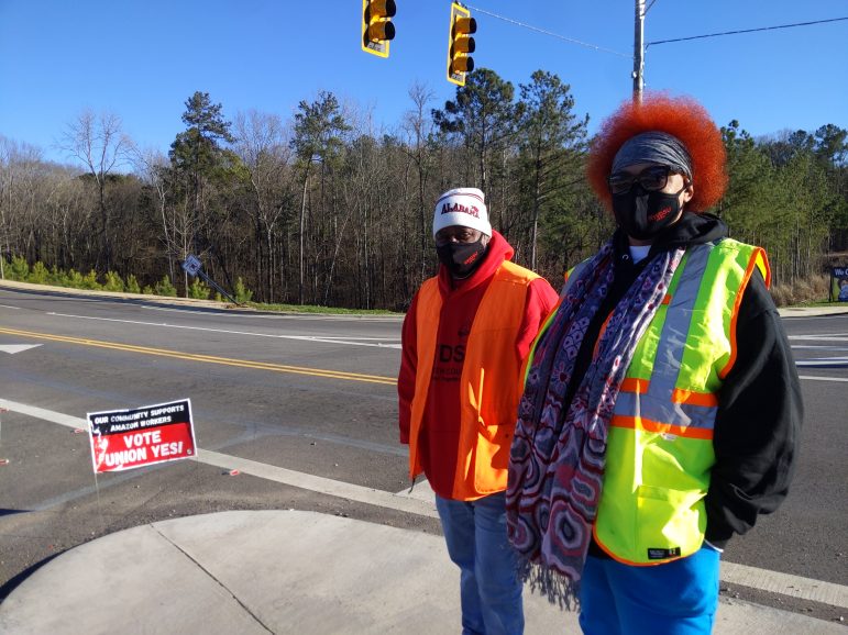 Members of the Retail, Wholesale and Department Store Union speak with Amazon workers leaving the Amazon warehouse in Bessemer, Alabama.