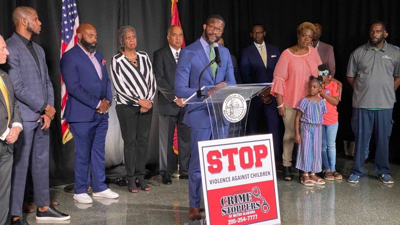 Mayor Randall Woodfin presenting $125,000 incentive with the support of Frank Barefield of Crime Stoppers, faith leaders, and the family of one of the victims.