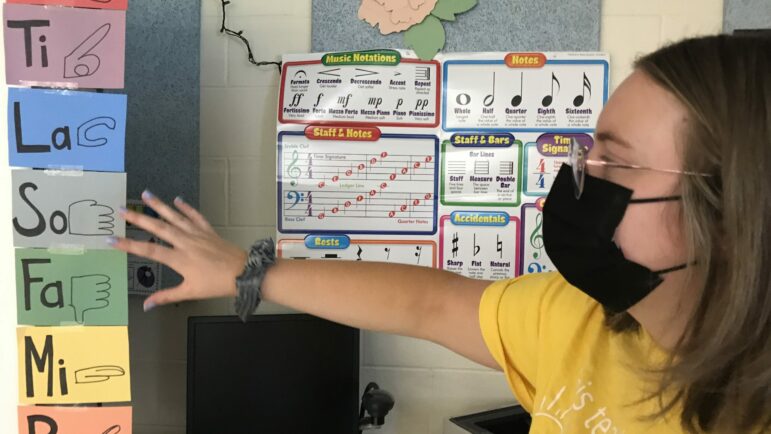 Anna Warner, the music teacher at Robinson Elementary School, gets ready to welcome students into her colorful music classroom.