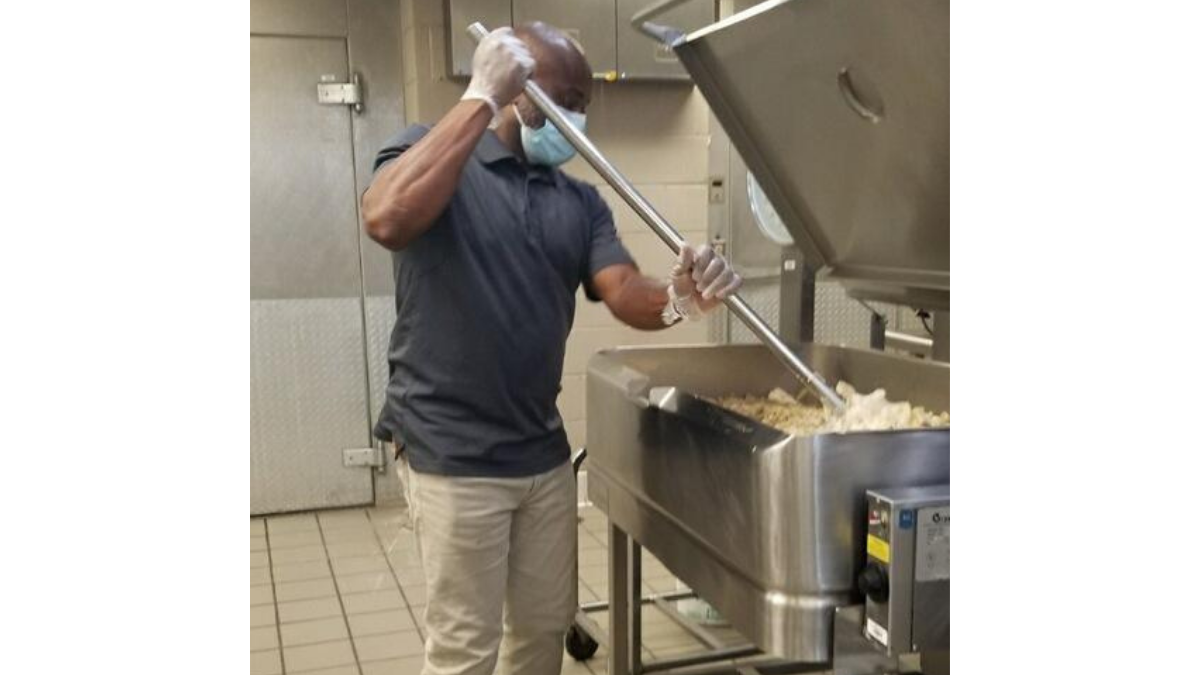 Logan The Entertainer cooking at Minor Elementary School