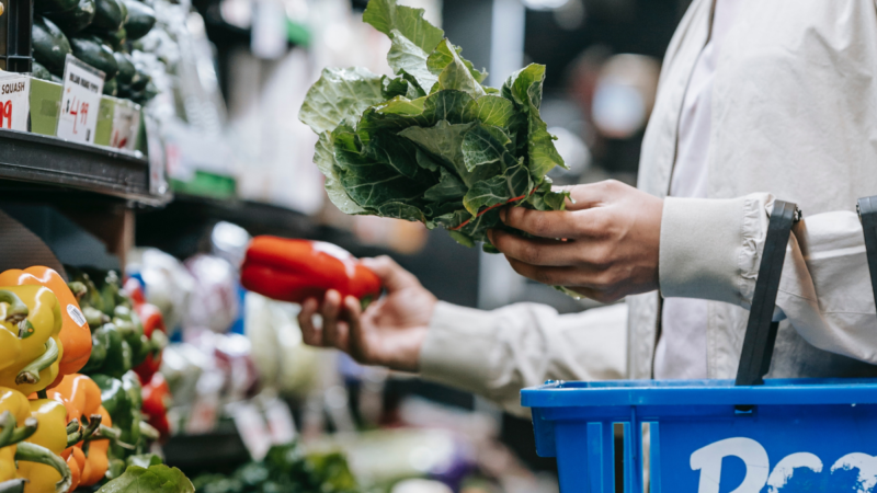 A person grocery shops in the produce section