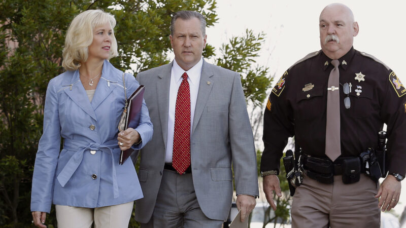 This photo from 2016 shows former Alabama Speaker Mike Hubbard and his wife, Susan Hubbard, walking to the Lee County Justice Center for his ethics trial.