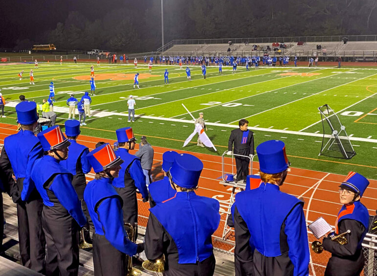 The Madison Central High School Band fills the football stadium stands of Jaguar Stadium before a Friday night football game in Madison, Mississippi. Madison Central is one school in Mississippi that does not have a COVID vaccine mandate for its students. Their opponent, Murrah High School, does.