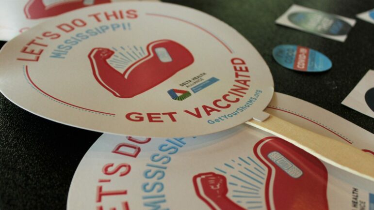 Stickers and fans from a COVID-19 vaccination clinic in Jackson, Mississippi
