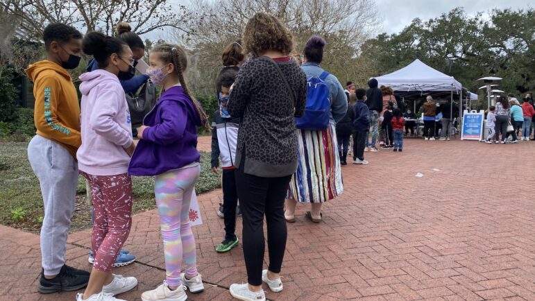 Hundreds of children and their parents lined up for a COVID-19 shot at a Louisiana Department of Health vaccine clinic in New Orleans.