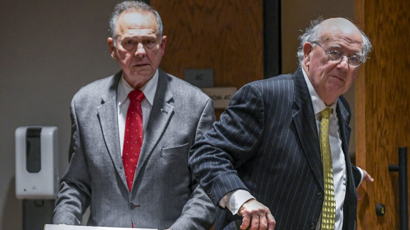 Former Alabama Chief Justice Roy Moore, left, and his attorney Julian McPhillips leave the courtroom in the Montgomery County Courthouse in Montgomery, Ala., on Monday, Jan. 24, 2022, following jury selection, as the trial with Leigh Corfman, who accused former Moore of sexual assault, and Moore's defamation lawsuits against each other begins. (Mickey Welsh/The Montgomery Advertiser via AP)