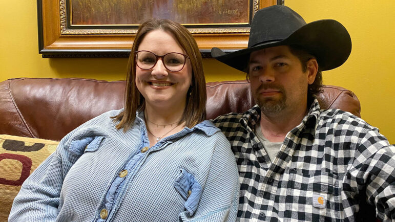 Caroline Nations, left, sits with her husband, Troy Nations. Troy survived the delta surge of COVID-19 thanks to King's Daughters Medical Center in Brookhaven, Mississippi.