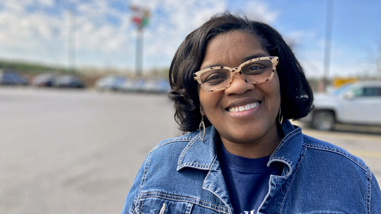 Miriam Leftwich poses for a photo in the parking lot of the Love's travel stop in Eutaw, Alabama.