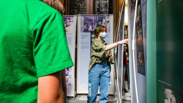Seventh-grader Abby Woods leads a group of fifth and sixth graders from Holy Name of Jesus School through a traveling exhibition titled "Anne Frank- a history for today" on March 17, 2022, at Loyola University of New Orleans.