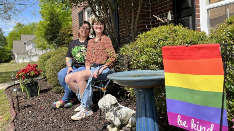 Erin Georgia and her kid Alex sit outside their home in Trussville. They have hope that the ban on gender-affirming care will be blocked in the courts.