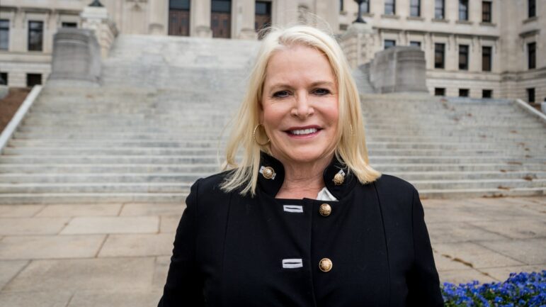 Anti-abortion activist Terri Herring stands outside the Mississippi State Capitol building in Jackson, Mississippi.