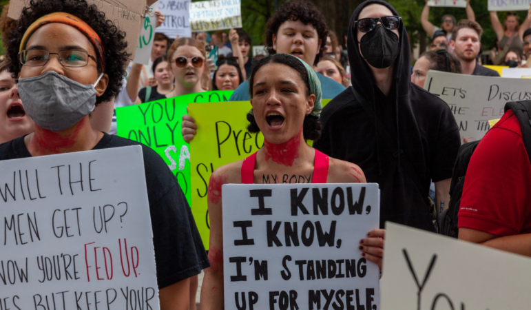 A crowd chants during a protest against the Supreme Court's ruling overturning Roe v. Wade on Saturday, June 25, 2022, in Birmingham.. Several hundred people massed in Linn Park for a rally organized by the Yellowhammer Fund which provides financial assistance for people seeking abortion care. (Photo by Rashah McChesney/Gulf States Newsroom - WBHM)