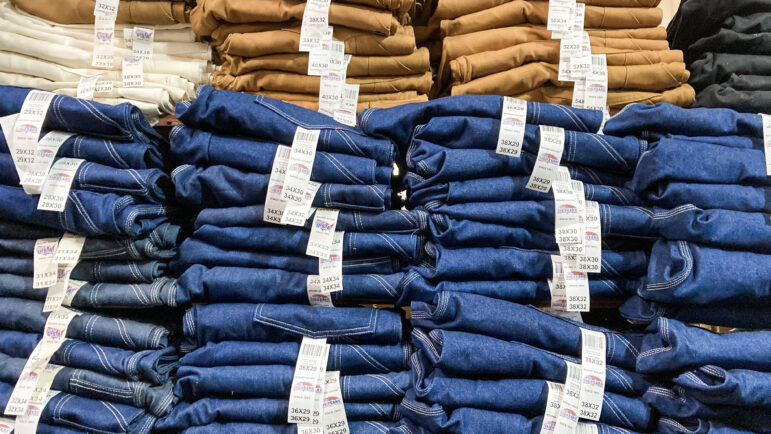 Pairs of Round House jeans are stacked high and on display at A.F. Carraway in Bassfield, Mississippi, July 1, 2022. 