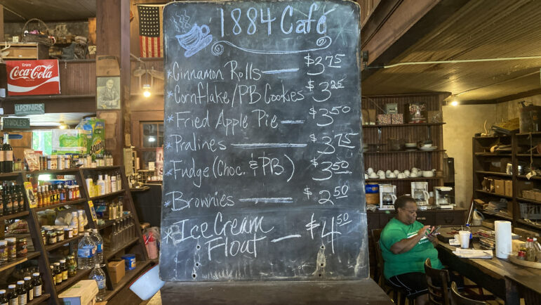A chalkboard displays desert specials at 1884 Cafe, the restaurant inside The Simmons-Wright Company in Kewanee, Mississippi, July 1, 2022. 