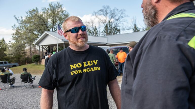 A coal miner wears a t-shirt that says "no luv for scabs' during a rally at the United Mine Workers of America union hall in Brookwood, Alabama.