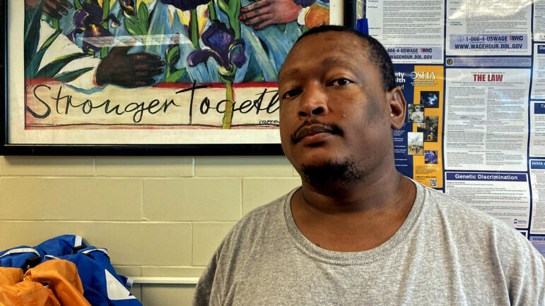 David Williams stands in the break room of the Dollar General store he works at in New Orleans, Louisiana.