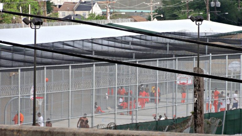 Incarcerated people at the Orleans Parish Prison as seen from the Jefferson Davis Parkway overpass.