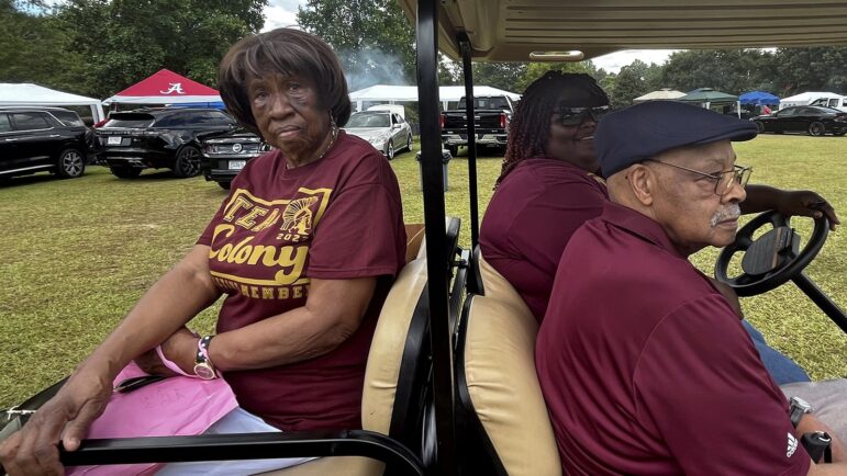 Odell Leeth (left), 96, and Eugene Vaugn (right), 94, are Colony, Alabama’s oldest living residents. Jasmine Cole, 27, drives them around in a golf cart during Colony Day in Colony, Alabama, Aug. 6, 2022.