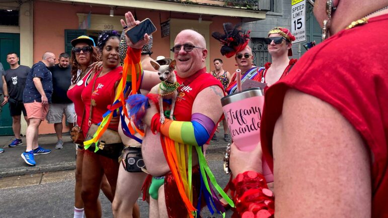 An unidentified man and his dog enjoy parades in New Orleans’ French Quarter at Southern Decadence, Sept. 4, 2022.