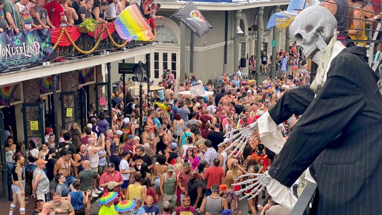 Southern Decadence revelers gather outside of Oz, a dance club in the 800 block of Bourbon Street in New Orleans, Sept. 4, 2022.