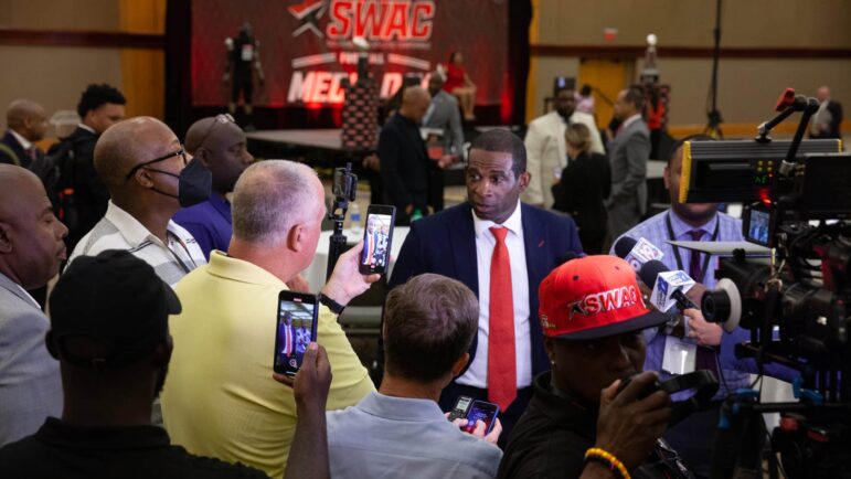 Jackson State University football coach Deion Sanders speaks to a group of media members during the Southwestern Athletic Conference’s media day event in Birmingham, Alabama, July 21, 2022.