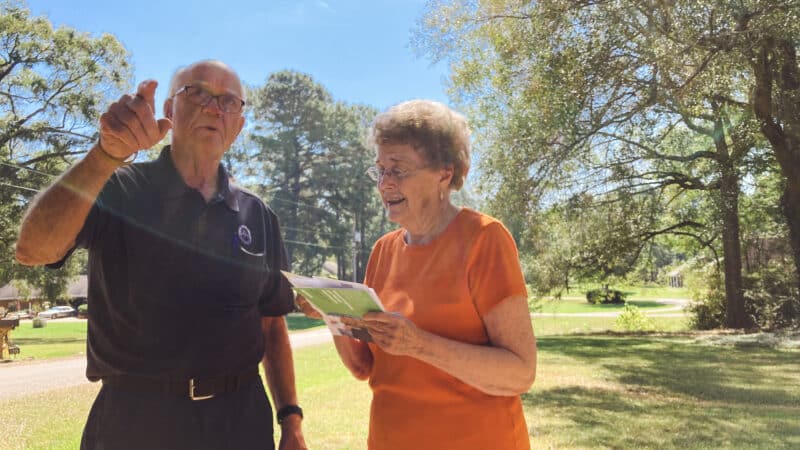Byram Mayor Richard White (left) speaks with resident Mildred Cochran about a leak in the street outside of her home, Oct. 7, 2022.