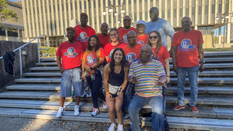 Staff members and some clients of the First 72+ pose on the steps of the New Orleans Police Department headquarters after a press conference preceding the NOLA to Angola bike ride, Oct. 15, 2022.