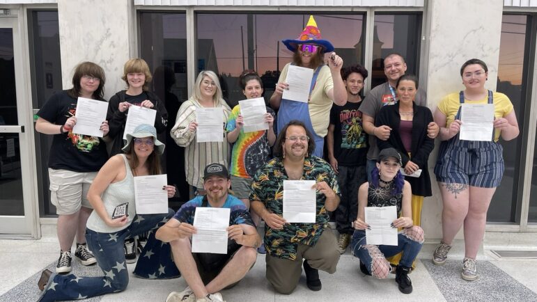 Cullman Comes Out organizers celebrate after receiving their event permit at a city council meeting on Sept. 12.