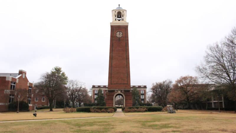 A clock tower stands in front of several buildings at Birmingham Southern College.