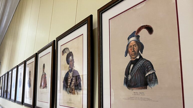 A row of Native American leaders from Alabama line the wall at the Alabama Archives in front of “The First Alabamians” exhibit, Nov. 8, 2022.