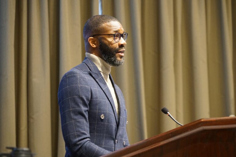Mayor Randall Woodfin stands at a podium as he gives his annual State of the City address in 2023.