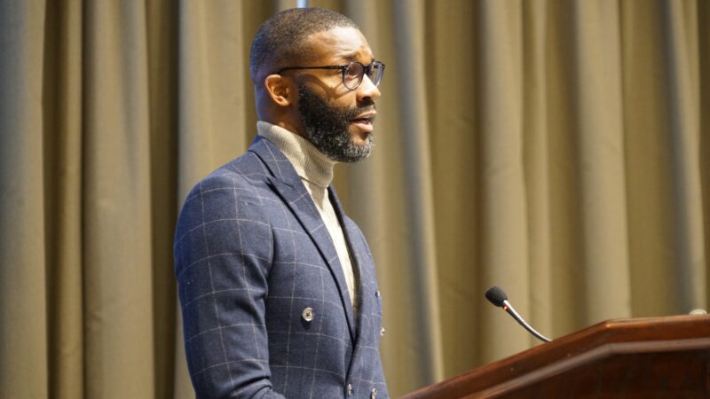 Mayor Randall Woodfin stands at a podium as he gives his annual State of the City address in 2023.
