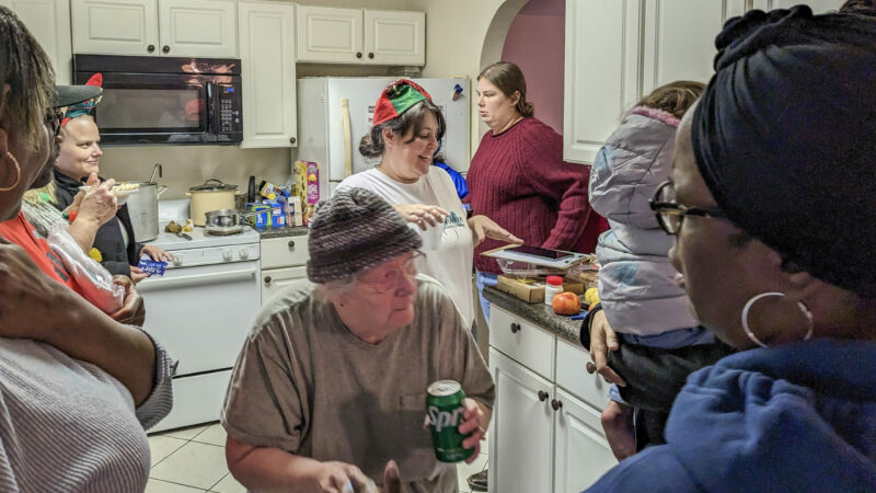 Residents in the Cherokee Forest neighborhood of Pascagoula, Mississippi, gather for a neighborhood party, December 17, 2022.