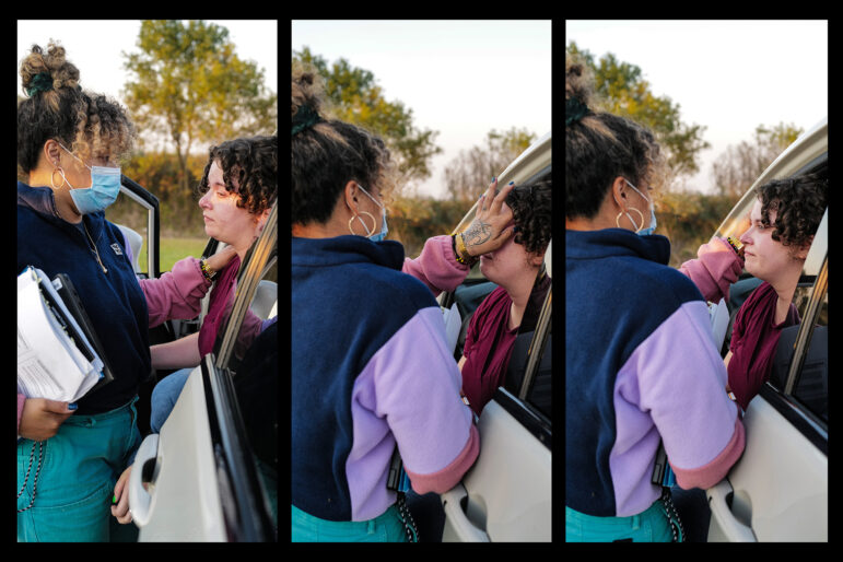 Tania Wolf (left), comforts Hannah Lopez as she sits in her car following a visit to a women’s immigration detention center in Basile, Louisiana.