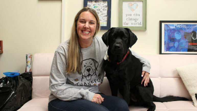 Dawn Norris, one of West Elementary Schools guidance counselors, sit with Merlin in her office.