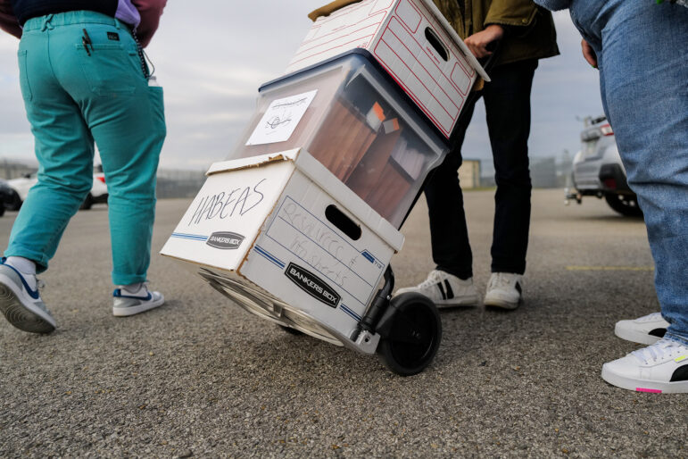 Advocates cart documents into the South Louisiana ICE Processing Center in Basile, Louisiana. The group is focused on teaching people about the Habeas Corpus process and in order for a detainee to navigate that on their own — everything must be done on paper, so they cart these documents in and out of every facility they visit.