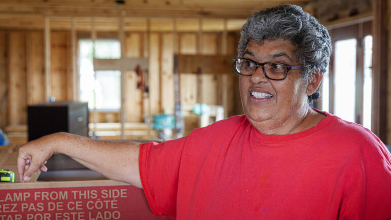 Ruth Crosby talks about the process of getting her home partially rebuilt by volunteers from the Amish organization C.A.R.E. in Golden Meadow, Louisiana, Jan. 16, 2023.