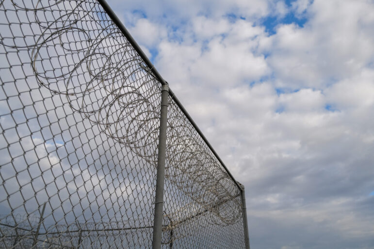 Barbed wire surrounds the South Louisiana ICE Processing Center in Basile, Louisiana.