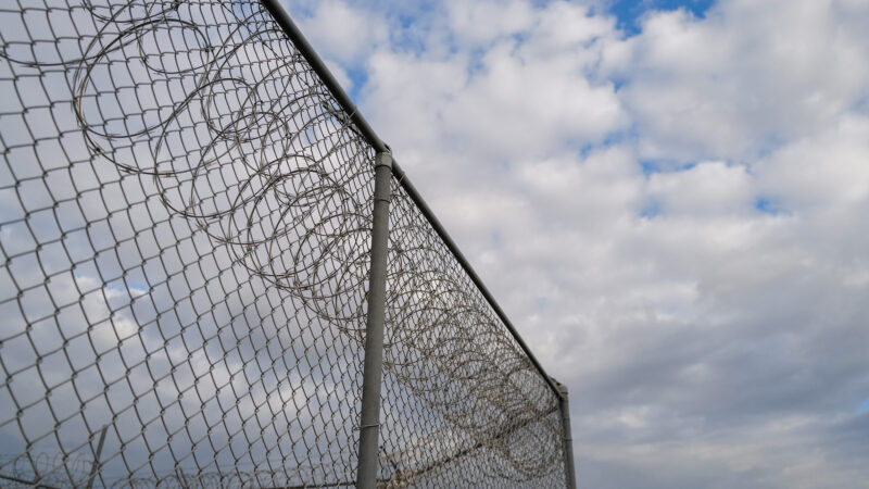 Barbed wire surrounds the South Louisiana ICE Processing Center in Basile, Louisiana.