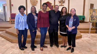 Members of the St. Joseph the Worker Church’s Health Ministry team — (from left to right) Rita Williams, Debbie Williams, Deborah Nettles, Father Sidney Speaks, Octavia Fennidy and Kathryn Rando — are pictured after a daily mass, Jan. 30, 2023.