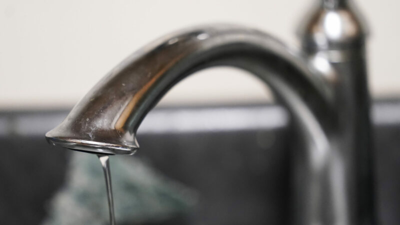A trickle of water comes out of a faucet in Jackson, Mississippi.