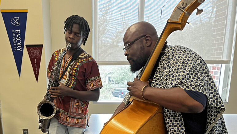 Christopher Frazier (right) plays the cello while one of his students plays the saxophone during Emmitt Glynn’s AP African American Studies class on March 2, 2023, at Baton Rouge Magnet High School. Mr. Frazier leads the orchestra department at the school and helped Mr. Glynn demonstrate different rhythms in African American music genres like blues, hip-hop and jazz.