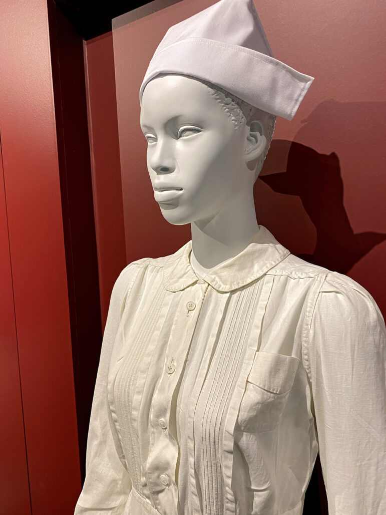 A display at the Smith Robertson Museum and Cultural Center's Scott Ford House Permanent Exhibit on Feb. 11, 2023, shows a typical uniform granny midwives wore. Granny midwives wore clothing similar to the nurses of the time — starched white gowns, a white hat and prim leather shoes.